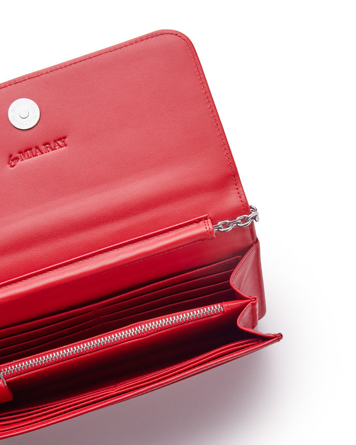 Red leather wallet with silver chain, multiple card slots, zippered coin pocket, and embossed "MIA RAY" logo inside.