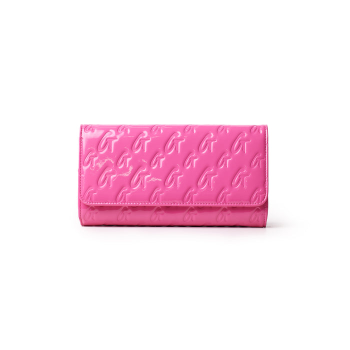 Mirror hot pink travel wallet with embossed monogram G pattern, glossy finish, and rectangular shape.