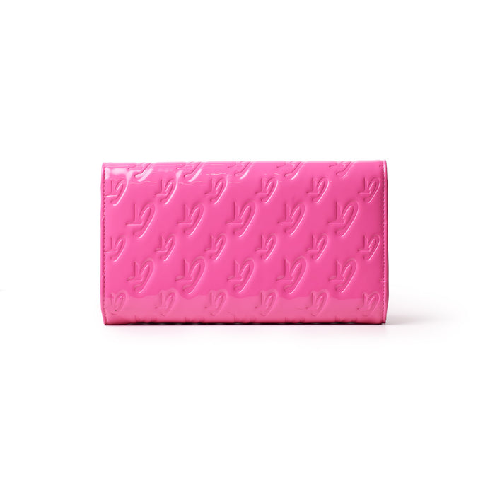 Mirror hot pink Monogram travel wallet with embossed logo pattern, sleek rectangular design, and glossy finish.