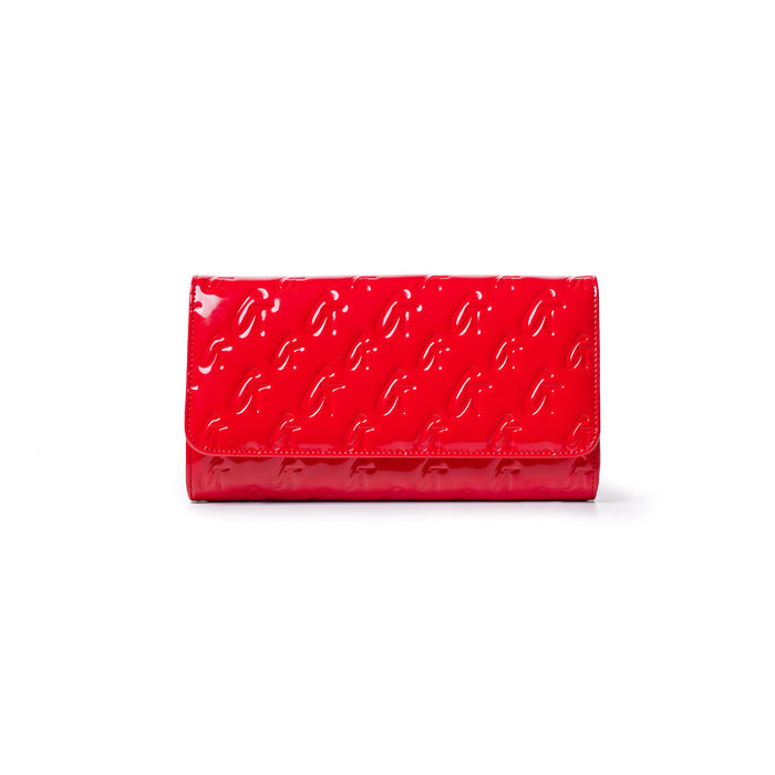 Red glossy Monogram Travel Wallet with embossed G pattern and sleek, reflective finish.