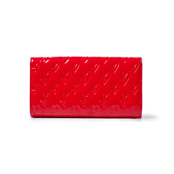 Red Monogram Travel Wallet with embossed logo pattern, sleek design, and mirror finish.