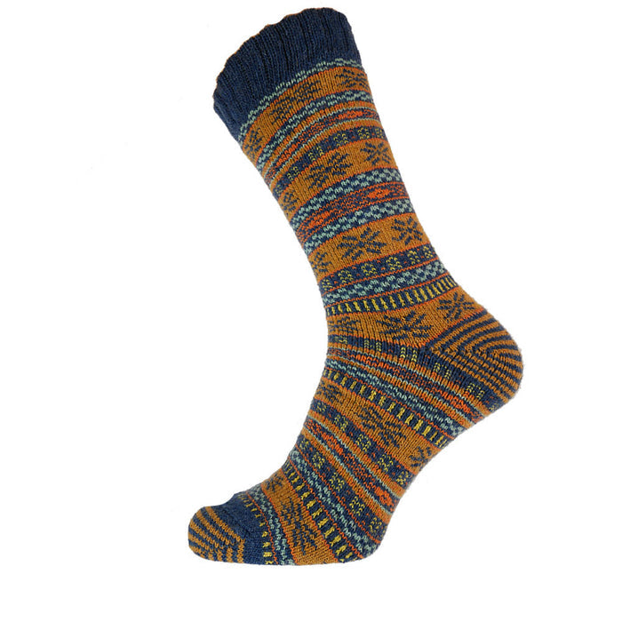 A socks with a mustard and blue Nordic pattern