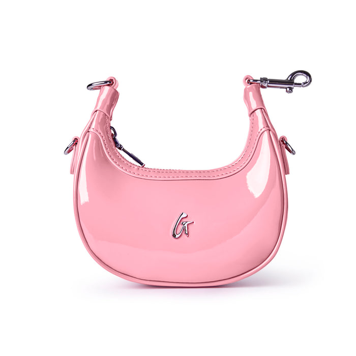 Light pink hobo bag with a glossy finish, featuring a sleek design and silver logo detail, perfect for stylish outings.