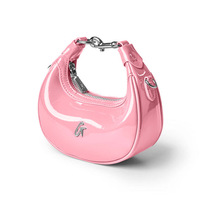 Light pink hobo bag with a glossy finish and silver hardware, perfect for adding a chic touch to any outfit.