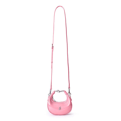 Light pink hobo bag with a sleek mirror finish and adjustable strap, perfect for adding a touch of luxury to any outfit.