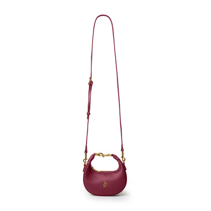 Burgundy Nano Pebble Hobo Bag with a gold-tone chain and adjustable strap, perfect for stylish everyday use.