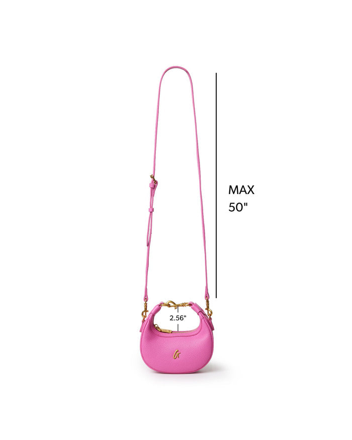 Hot pink Nano Pebble Hobo Bag with adjustable strap, featuring a sleek design and gold accents for stylish appeal.