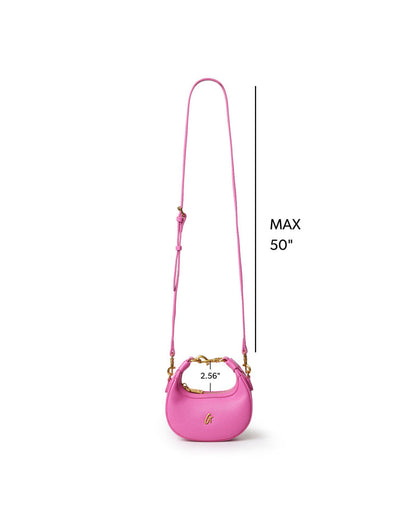 Hot pink Nano Pebble Hobo Bag with adjustable strap, featuring a sleek design and gold accents for stylish appeal.