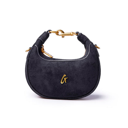Black nano suede hobo bag featuring a gold logo and stylish curved design, perfect for everyday elegance.