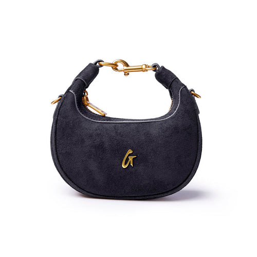 Black nano suede hobo bag featuring a gold logo and stylish curved design, perfect for everyday elegance.