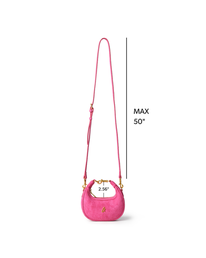 Hot pink nano suede hobo bag with adjustable strap and gold hardware, perfect for stylish everyday use.