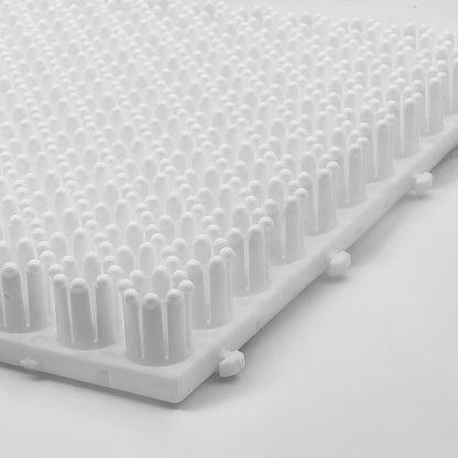 Close-up of the white ski training mat  on a light grey background