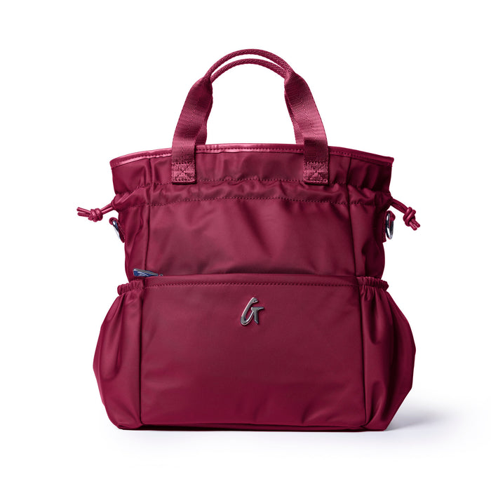 Burgundy nylon lunch bag with dual handles and adjustable side pockets for convenient storage and style.