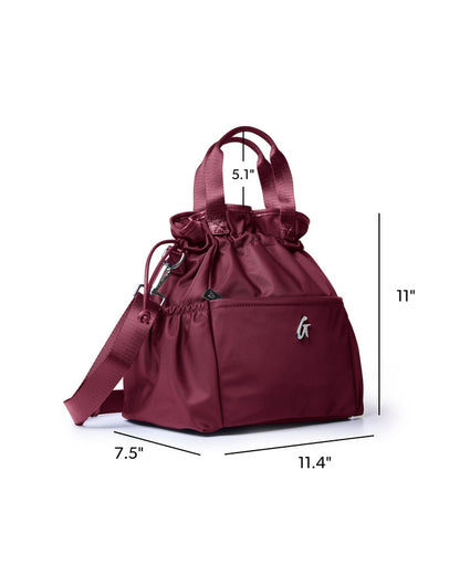 Burgundy nylon lunch bag with a drawstring top, side pocket, and adjustable strap for stylish, practical use.