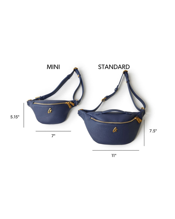 Navy pebble fanny pack displayed in mini and standard sizes, featuring gold zippers and adjustable straps.