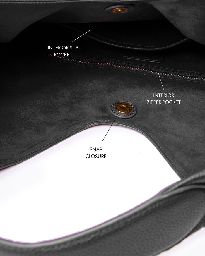 Interior view of the Pebble Hobo Shoulder Bag in black, featuring slip and zipper pockets, and a snap closure.