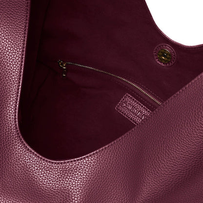 Burgundy pebble hobo shoulder bag featuring a spacious interior and zippered pocket for secure storage.