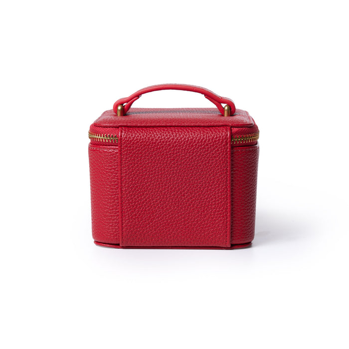 Red pebble leather jewelry case with a handle and gold zipper, designed for storing and organizing jewelry accessories.