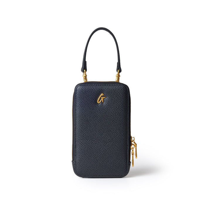 Black Pebble Phone Crossbody bag with gold accents and a top handle, designed for carrying a phone and small essentials.