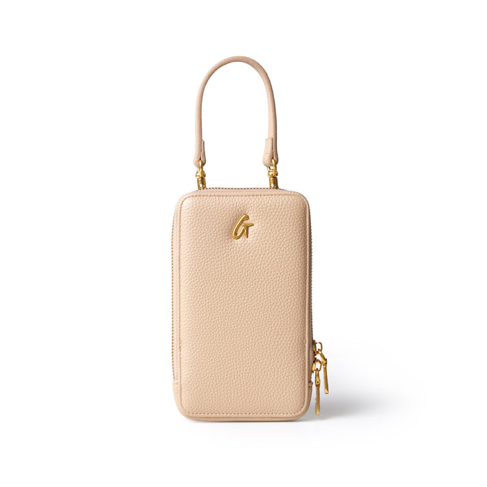 Nude Pebble Phone Crossbody bag with gold hardware, a top handle, and a zippered closure, designed for stylish convenience.
