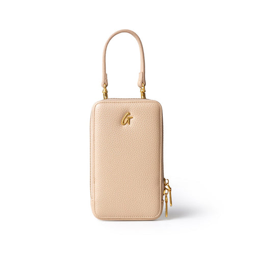 Nude Pebble Phone Crossbody bag with gold hardware, a top handle, and a zippered closure, designed for stylish convenience.