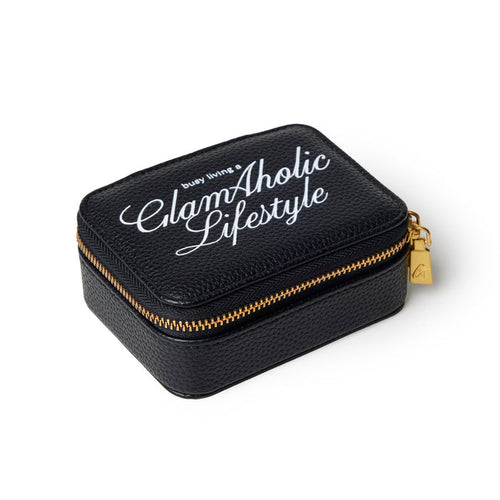 Black pebble pill case with gold zipper and Glam-Aholic Lifestyle logo, perfect for stylish organization.
