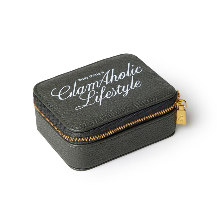 Olive green pebble pill case with gold zipper and Glam-Aholic Lifestyle logo, perfect for stylish organization.