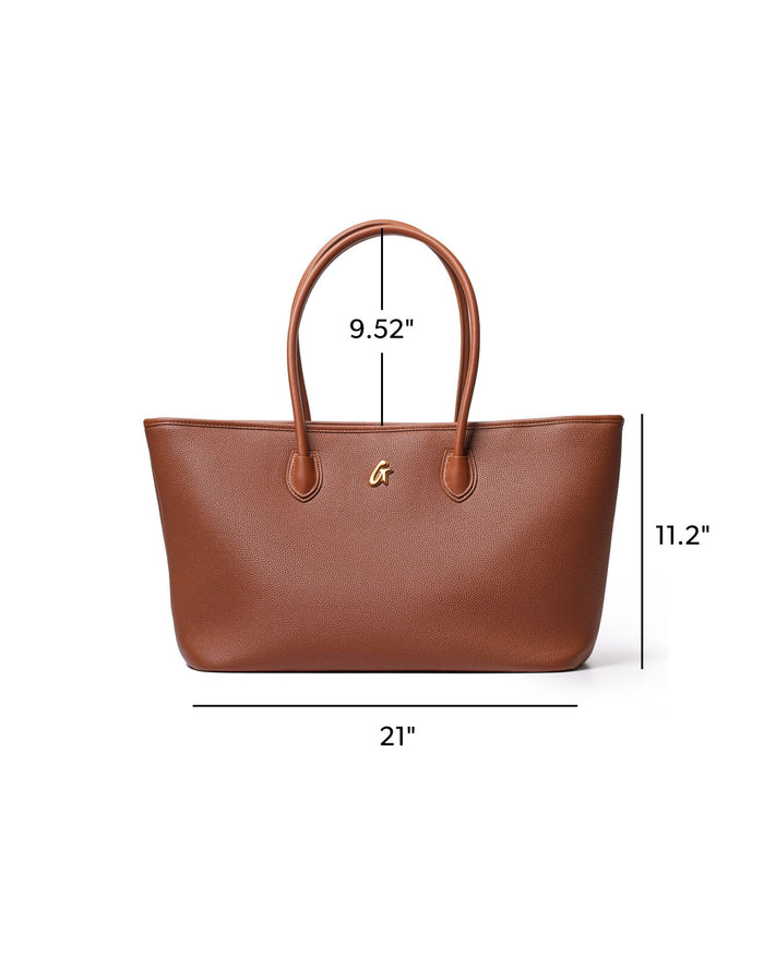 Brown pebble tote bag with gold logo, featuring spacious interior and sturdy handles, ideal for everyday use.