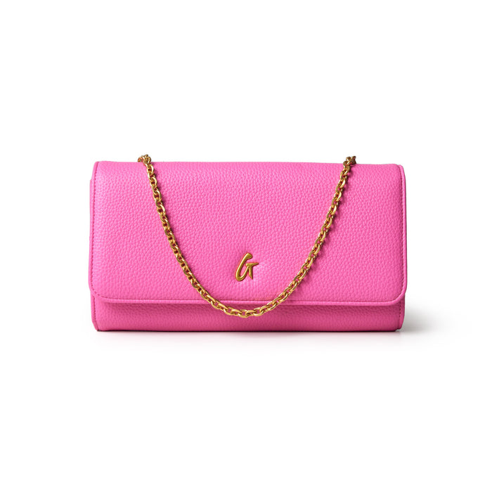 Pink Pebble Travel Wallet with a gold chain and logo, designed for stylish travel organization.