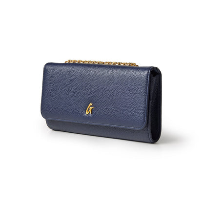 Navy Pebble Travel Wallet with gold chain and logo, made of textured leather, designed for travel essentials.