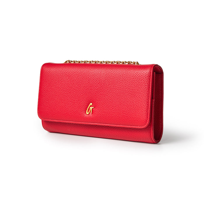 Red Pebble Travel Wallet with gold chain and logo, designed for stylish travel organization.
