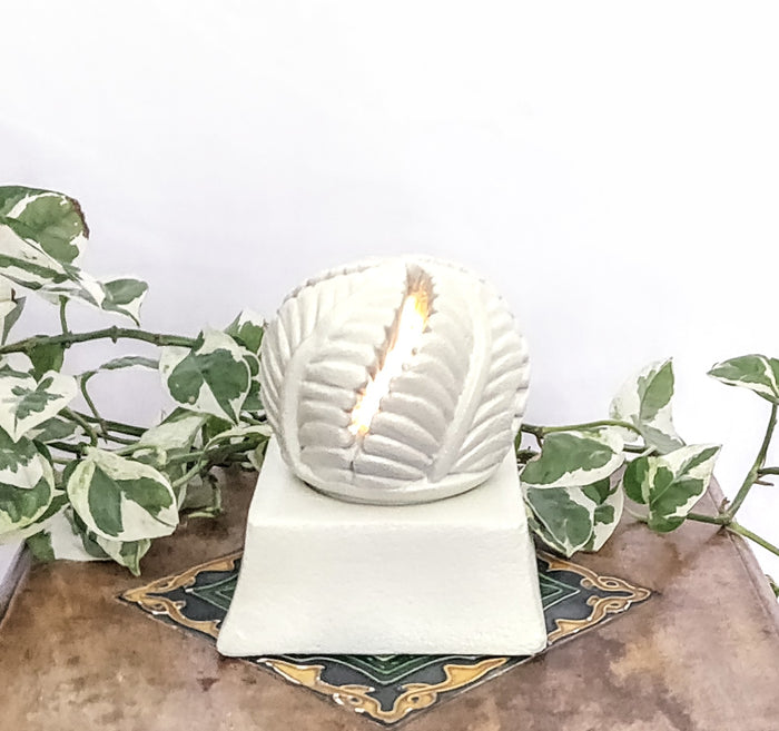 SANDSTONE TEA LIGHT CANDLE HOLDER.