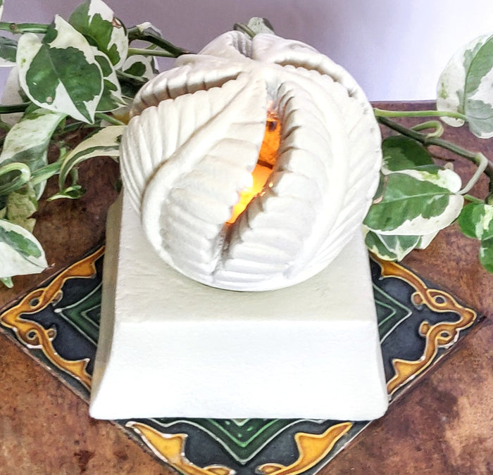 SANDSTONE TEA LIGHT CANDLE HOLDER.