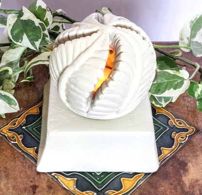 SANDSTONE TEA LIGHT CANDLE HOLDER.