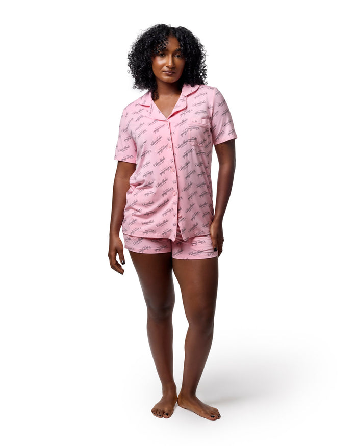 Light pink pajama short set featuring a stylish print, designed for comfort and elegance in loungewear.