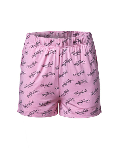 Light pink pajama shorts featuring a stylish Glam-Aholic logo print, perfect for comfortable, chic loungewear.
