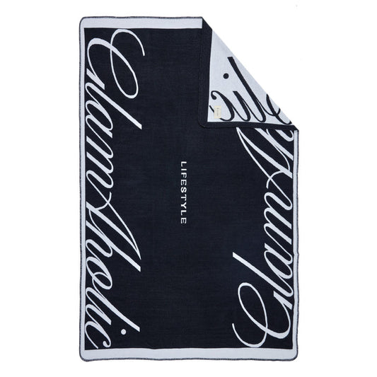 Black luxury throw blanket with bold white cursive "Signature Logo" text and "LIFESTYLE" in the center.