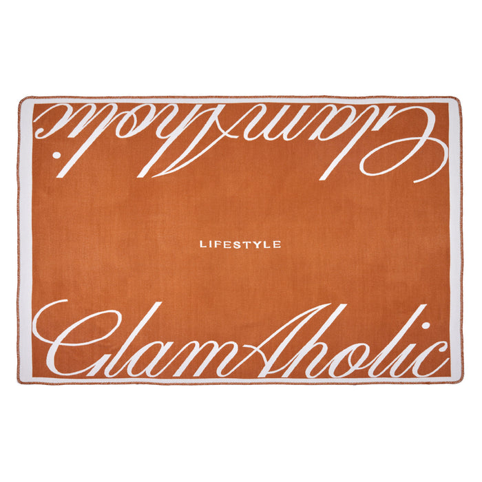 Brown luxury throw blanket with white script text reading "Chic Aholic" and "Lifestyle" on a white border.