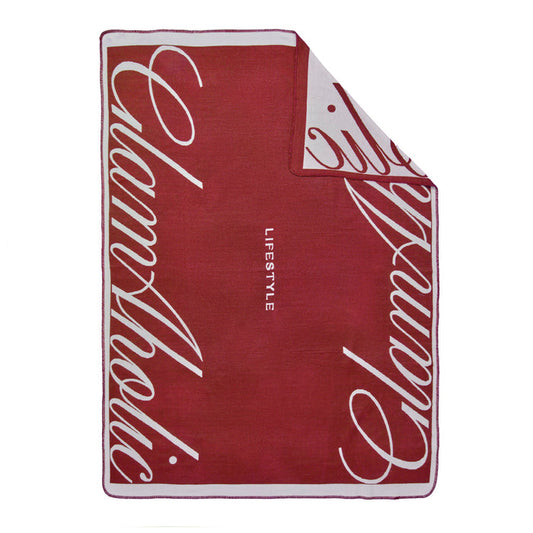 Burgundy throw blanket featuring the Glam-Aholic logo, perfect for adding luxury and comfort to any space.
