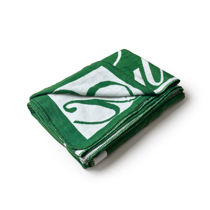 Luxurious green throw blanket featuring a stylish signature design, perfect for cozying up in style.