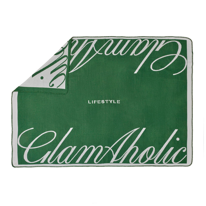 Green throw blanket featuring the GlamAholic logo and "LIFESTYLE" text for a chic and cozy accent.