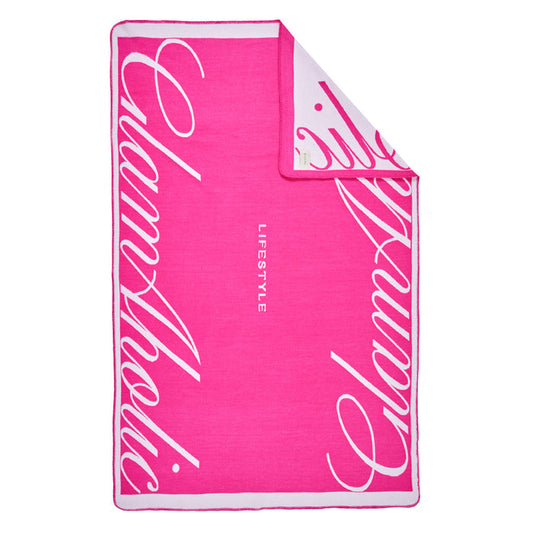 Hot pink throw blanket with white cursive "Signature Logo" text and "LIFESTYLE" in the center.
