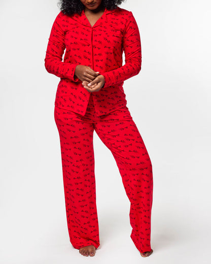 Red signature pajamas featuring a stylish print, designed for comfort and a chic look. Perfect for cozy nights.
