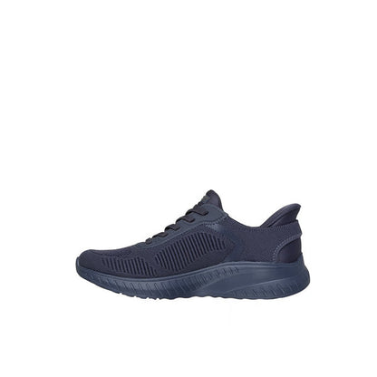 Women's slip-on walking sneaker, dark navy knit upper, side profile with cushioned sole