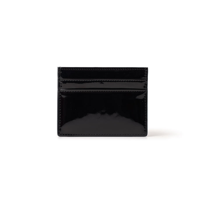 Black mirror finish gold card holder with multiple card slots, compact and stylish for everyday use.