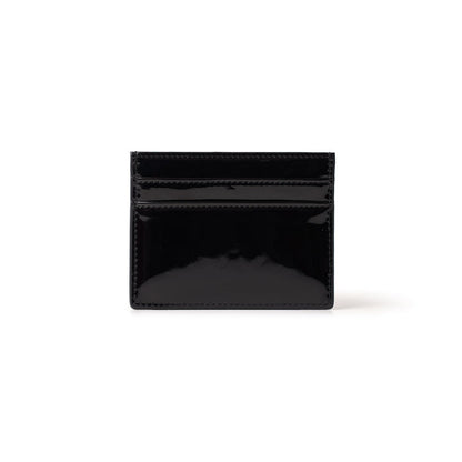 Black mirror finish gold card holder with multiple card slots, compact and stylish for everyday use.