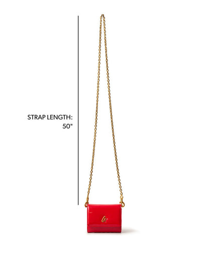 Compact gold wallet on a chain in mirror red with a 50-inch strap, perfect for stylish, on-the-go convenience.