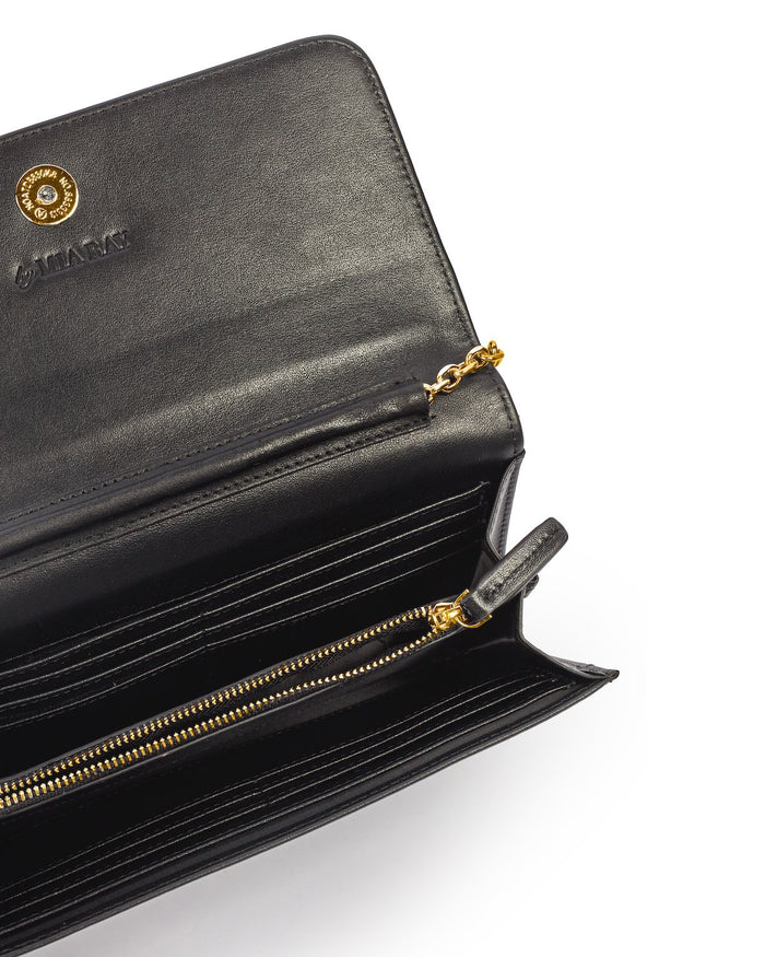 Black leather wallet with gold zipper, multiple card slots, and a chain detail, labeled "STANDARD GOLD WOC - BLACK.
