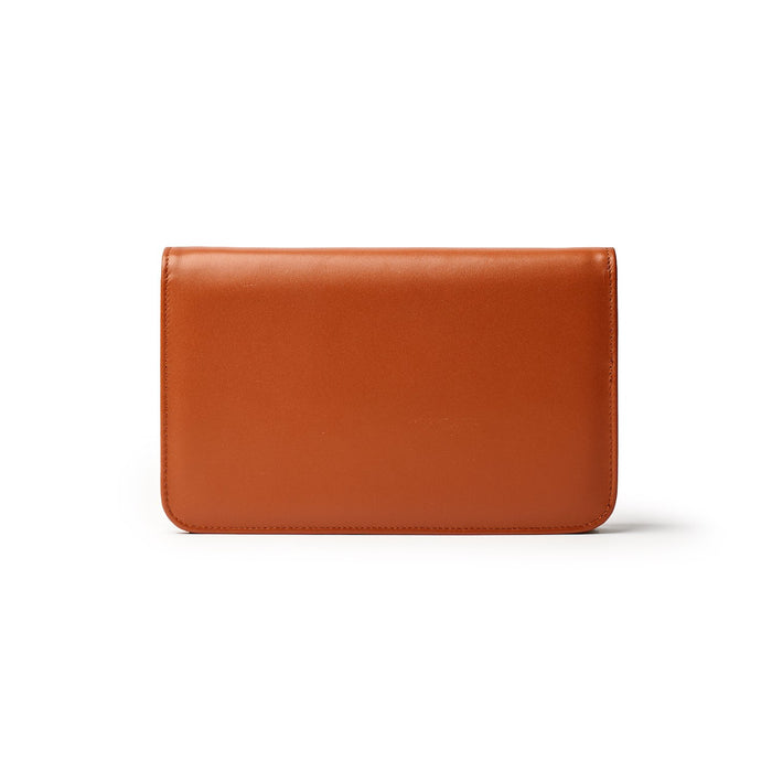 Brown leather wallet with a sleek, minimalist design and smooth finish, labeled "STANDARD GOLD WOC - BROWN.