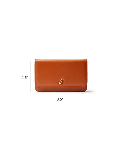 Brown STANDARD GOLD WOC handbag with a sleek design, featuring a gold logo and dimensions of 4.5 by 8.5 inches.